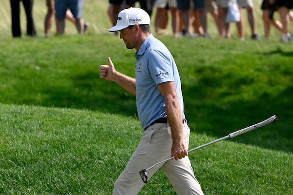 Keegan Bradley gives a thumbs up to as the crowd chants "USA" as he approaches the ninth green during the third round of the Travelers Championship golf tournament at TPC River Highlands, Saturday, June 21, 2025, in Cromwell, Conn. (AP Photo/Jessica Hill)
