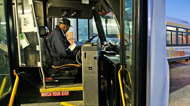 100331- Jonesboro - C-Tran bus driver, Pete Freeman waits for C-Tran riders to board for the last time at the Harold R. Banke Justice Center, 9151 Tara Boulevard in Jonesboro. When Clayton County's C-Tran bus system shuts down before midnight Wednesday, March 31, 2010 many passengers will be stranded. But for those who commute Monday through Friday to or from downtown Atlanta around standard office hours and can make it to one of the Xpress stops, commuter buses are an option. Fares are higher than C-Tran�s. For those paying cash (Xpress takes exact change only) it�s $3 one way, $5 round-trip. The Georgia Regional Transportation Authority (GRTA), which runs the buses, tried to add more routes that would fill the gap for about 25 percent of C-Tran�s riders, according to GRTA�s Jim Ritchey. But there was no long-term funding, so that won't happen. John Spink, jspink@ajc.com