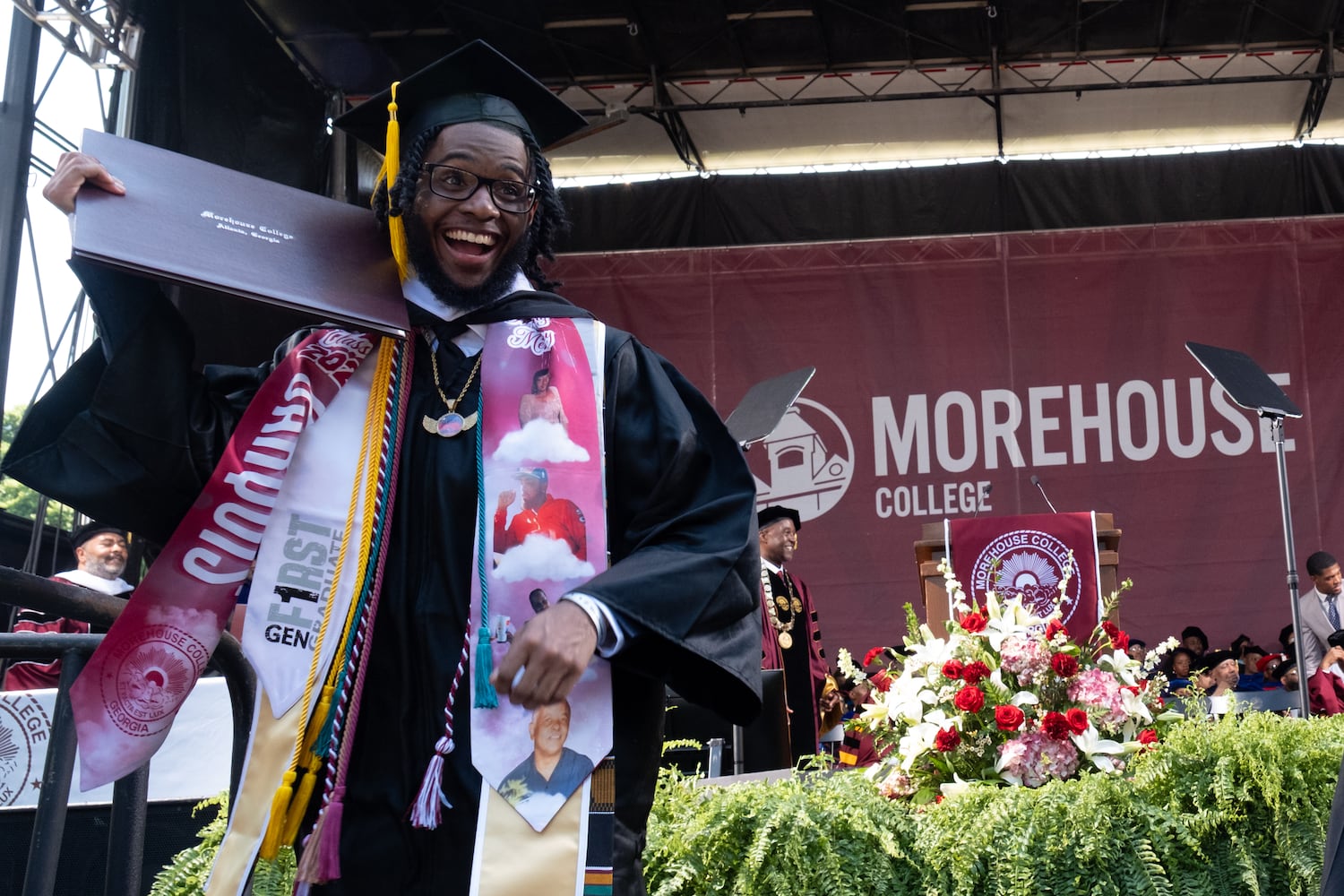 A student celebrates after receiving his diploma during the Morehouse College graduation Sunday, May 17, 2026. (Ben Gray for the AJC)
