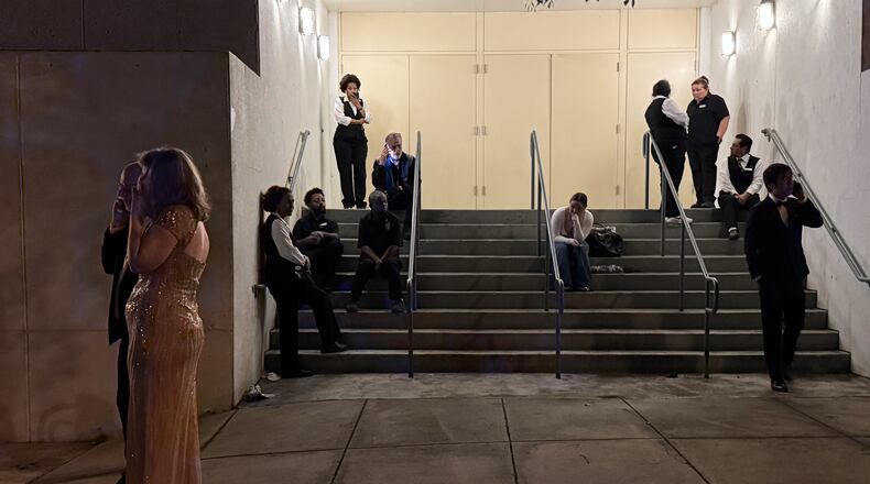Attendees and hotel workers evacuate after an incident at the Washington Hilton during the White House Correspondents Dinner, Saturday, April 25, 2026, in Washington. (AP Photo/Mark Schiefelbein)