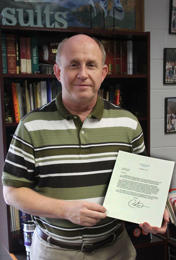 Georgia Middle School Principal of the year Brian Suits with the personal response from President Obama to a letter Suits sent. (Dalton Public Schools.)