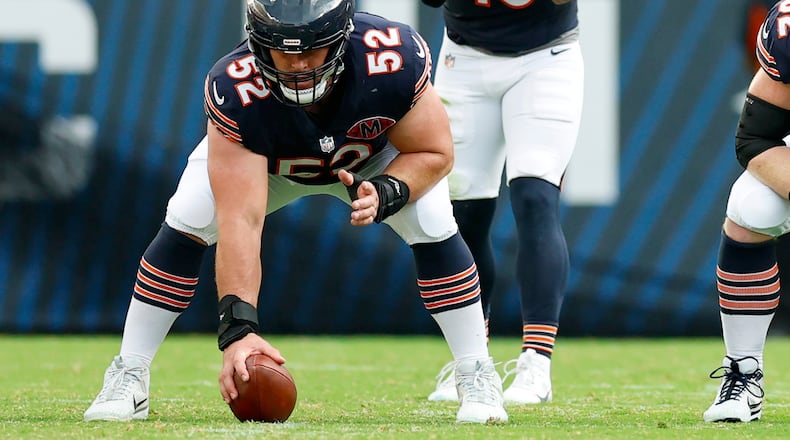 FILE - Chicago Bears center Drew Dalman (52) prepares to snap the ball during the second half of an NFL football game against the Dallas Cowboys, Sunday, Sept. 21, 2025, in Chicago. (AP Photo/Kamil Krzaczynski, File)