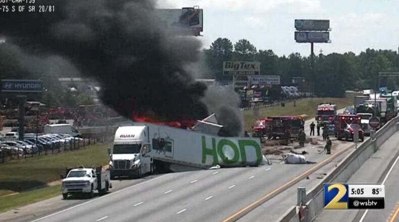 The family of four people who were killed in a fiery crash involving a tractor-trailer in May have filed a suit against several companies and individuals.