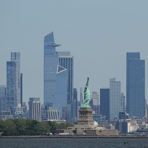 FILE - The New York skyline and Statue of Liberty are seen on May 12, 2025. (AP Photo/Matt Rourke, File)