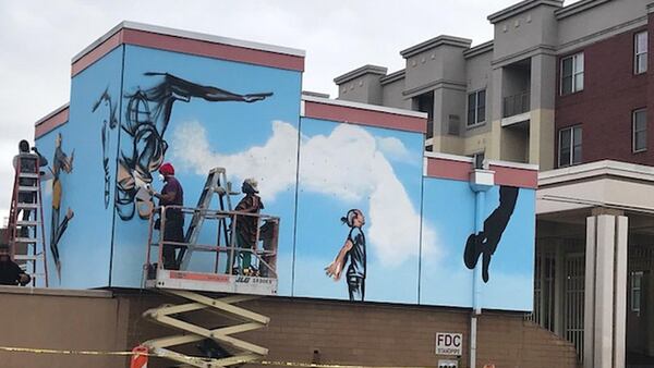 A reader submitted this photo of artist Fahamu Pecou with support artists Denisha Claxton and Fabian Williams working on a mural called “The People Could Fly” at MARTA’s Ashby Transit Station. An effort of the Transformation Alliance, including MARTA’s Artbound, Wonderroot and the Arthur Blank Foundation, this is the third of four murals. The final one will be installed at H.E. Holmes later in the spring. CONTRIBUTED BY JOY BARNES