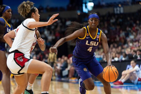 LSU guard Flau'Jae Johnson (4) goes to the basket during the first half in the Sweet 16 of the NCAA college basketball tournament against North Carolina State, Friday, March 28, 2025, in Spokane, Wash. (AP Photo/Jenny Kane)
