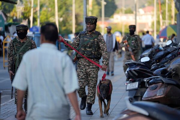 Indian paramilitary soldiers patrol as they guard at a busy market in Srinagar, Indian controlled Kashmir, Tuesday, April 29, 2025. (AP Photo/Mukhtar Khan)