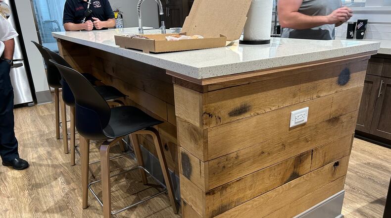 The post oak trees removed from Milton’s Broadwell Pavilion in 2016 have been repurposed as a kitchen island at the newly opened Fire Station 42. (Courtesy City of Milton)