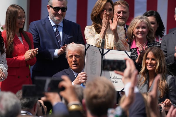 President Donald Trump, with first lady Melania Trump and others, after signing the "Take It Down Act" during a ceremony in the Rose Garden at the White House, Monday, May 19, 2025. (AP Photo/Manuel Balce Ceneta)