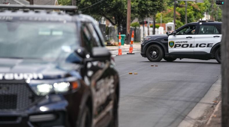 Police work on Canal Street in Houston, Tuesday, July 7, 2026, after a shooting. (Jacob Lujan/Houston Chronicle via AP)
