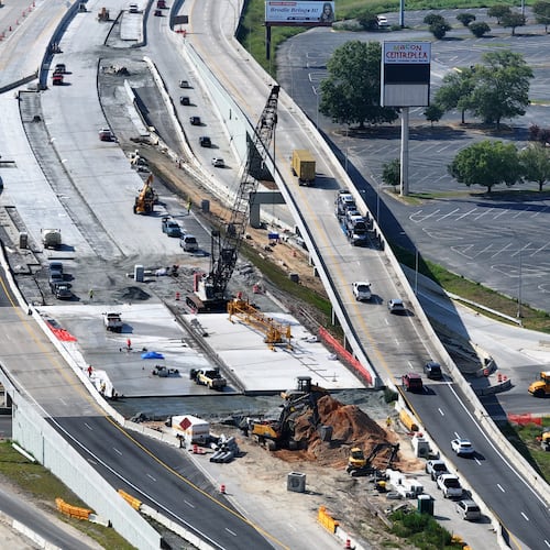 An aerial view of construction along I-16 near the Macon Coliseum, just east of the freeway's long-under-construction interchange at I-75. (Hyosub Shin/AJC)