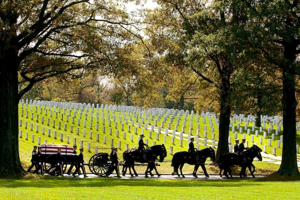 FILE - A U.S. Army Caisson team carries the remains of Army Pfc. Tramaine J. Billingsley during burial services at Arlington National Cemetery in Arlington, Va., Nov. 2, 2010. (AP Photo/Kevin Wolf, File)