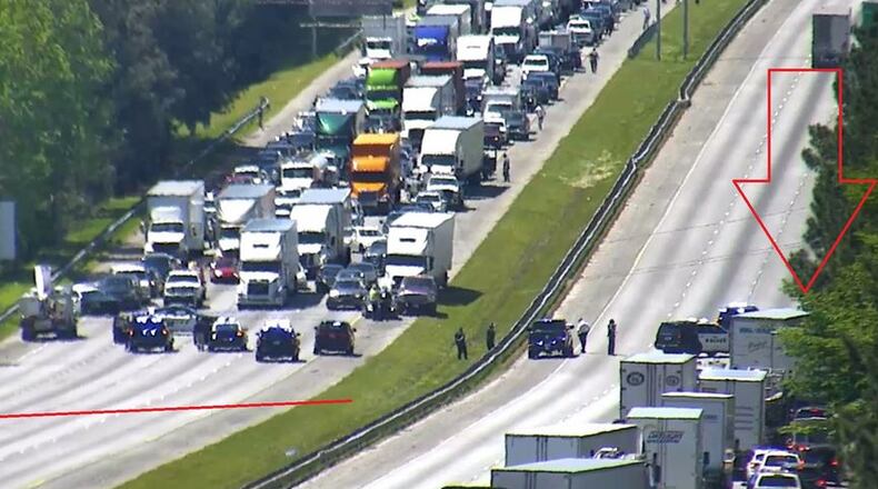 Downed power lines blocked I-20  in Douglasville for more than two hours Tuesday.