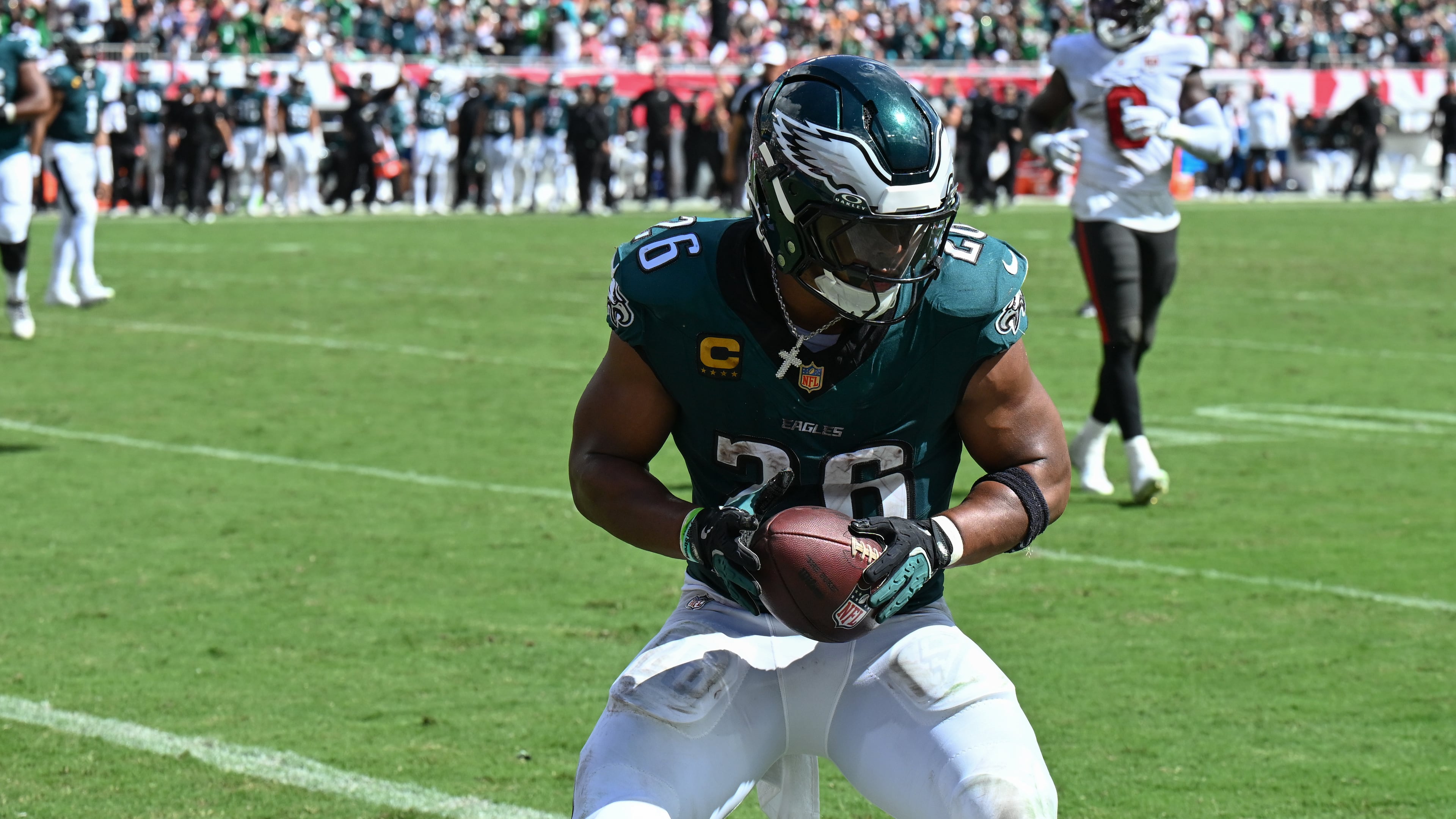 Philadelphia Eagles running back Saquon Barkley (26) scores a touchdown during the second half of an NFL football game against the Tampa Bay Buccaneers, Sunday, Sept. 28, 2025, in Tampa, Fla. (AP Photo/Jason Behnken)