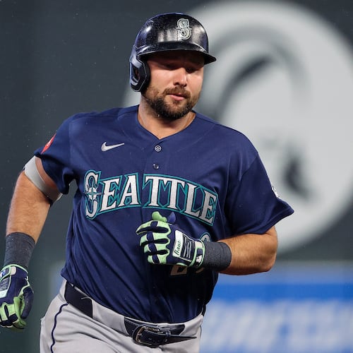 Seattle Mariners designated hitter Cal Raleigh runs the bases after hitting a two-run home run against the Minnesota Twins during the eighth inning of a baseball game, Monday, April 27, 2026, in Minneapolis. (AP Photo/Matt Krohn)