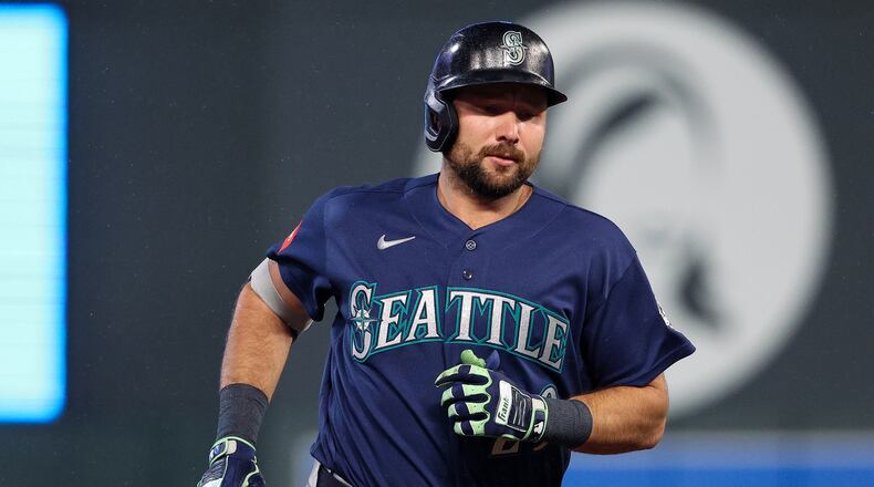 Seattle Mariners designated hitter Cal Raleigh runs the bases after hitting a two-run home run against the Minnesota Twins during the eighth inning of a baseball game, Monday, April 27, 2026, in Minneapolis. (AP Photo/Matt Krohn)
