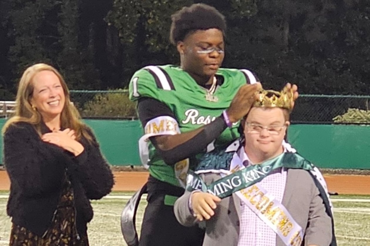 Roswell quarterback Trey Smith was named homecoming king and promptly redirected the honor to team student assistant Jake Jeffries. (Photo: Cassidy Windsor)