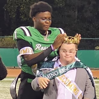 Roswell quarterback Trey Smith was named homecoming king and promptly redirected the honor to team student assistant Jake Jeffries. (Photo: Cassidy Windsor)
