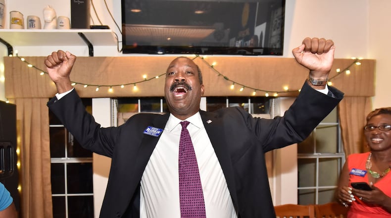 Steve Bradshaw celebrates his victory during a watch party DeKalb Commission District 4 race on Tuesday. Bradshaw overwhelmingly defeated DeKalb Commissioner Sharon Barnes Sutton. HYOSUB SHIN / HSHIN@AJC.COM