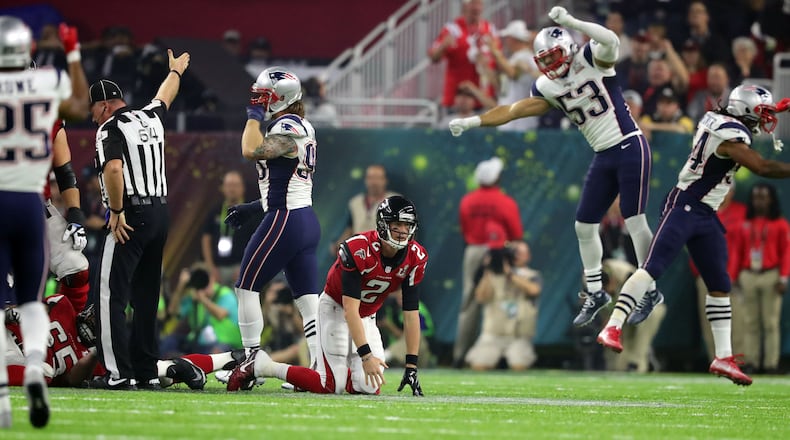 New England players celebrate a fumble by Falcons quarterback Matt Ryan fumble, leading to a Patriots touchdown drive and signaling a comeback. New England tied the game in the fourth quarter and won in overtime, winning their fifth Super Bowl in their seventh trip to the game at NRG Stadium in Houston. (Curtis Compton/ccompton@ajc.com)