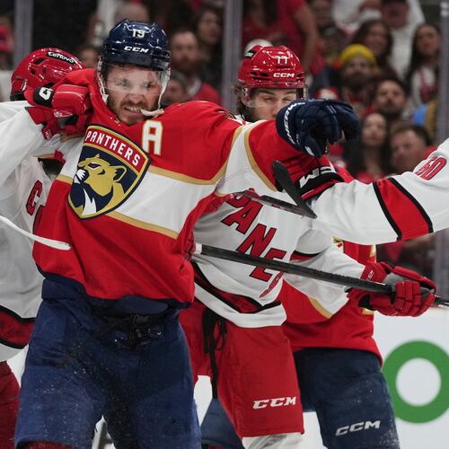 FILE - Florida Panthers left wing Matthew Tkachuk (19) scuffles with Carolina Hurricanes players during the second period in Game 3 of the NHL hockey Stanley Cup Eastern Conference finals Saturday, May 24, 2025, in Sunrise, Fla. (AP Photo/Lynne Sladky, File)