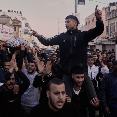 Mourners carry the body of the Palestinian Hassan Ahmed Jamil Moussa,19, who, according to health authorities, was killed during an Israeli raid last night, during his funeral in the Askar camp near the West Bank city of Nablus, Sunday, Nov. 16, 2025. (AP Photo/Majdi Mohammed)