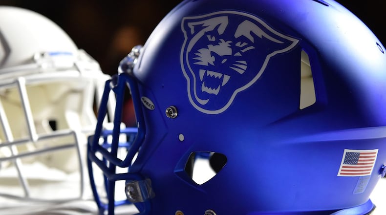 Helmets with the Georgia State logo sits on a table after a news conference where Shawn Elliott was introduced as the head football coach for Georgia State in Atlanta, Georgia, on Friday, Dec. 9, 2016. (DAVID BARNES / AJC file)