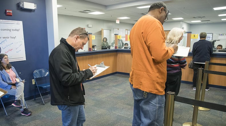 Gwinnett County residents fill out paperwork before casting their ballot during early voting for the county’s MARTA referendum at the Board of Voter Registrations and Elections building in Lawrenceville on Feb. 25. (ALYSSA POINTER/ALYSSA.POINTER@AJC.COM)