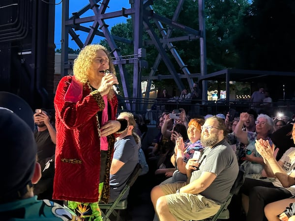 "Weird Al" Yankovic strolls through the audience during his break-up ballad "One More Minute" midway through his concert.(Rodney Ho/AJC)