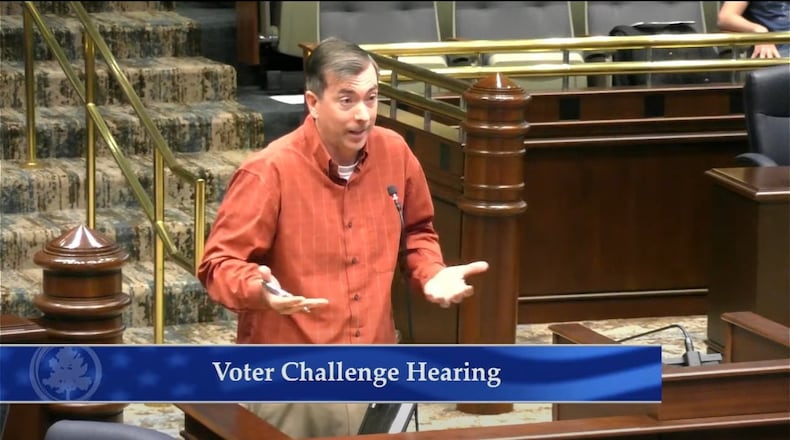 Jason Frazier speaks about his challenges to voter eligibility during a Fulton County elections board meeting in March. Frazier, one of the most prolific users of Georgia’s 2021 voting law that allows anyone to contest an unlimited number of other voters’ qualifications, is a Republican Party nominee to serve on the Fulton election board.