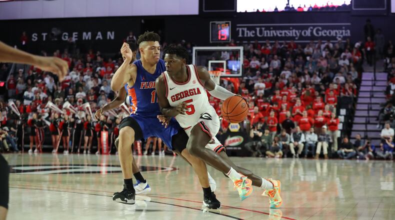 Georgia guard Anthony Edwards drives past Florida forward Keyontae Johnson in a NCAA college basketball game on Wednesday, March 4, 2020, in Athens. Curtis Compton ccompton@ajc.com
