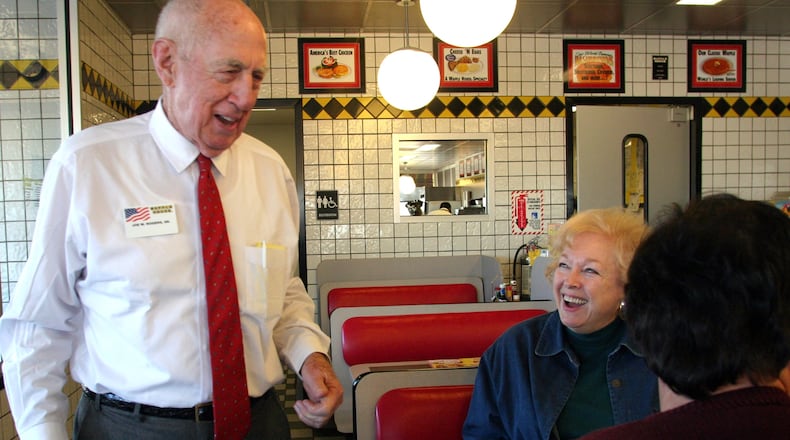 Joe Rogers Sr., the Waffle house co-founder who died Friday at 97, shown chatting with customers in an AJC file photo.