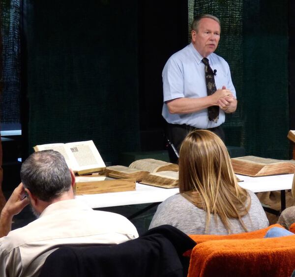 Mike Morgan collected ancient Bibles and other religious texts. Here he presents part of his collection and lectures at King University in Tennessee. Courtesy of Martin Dotterweich