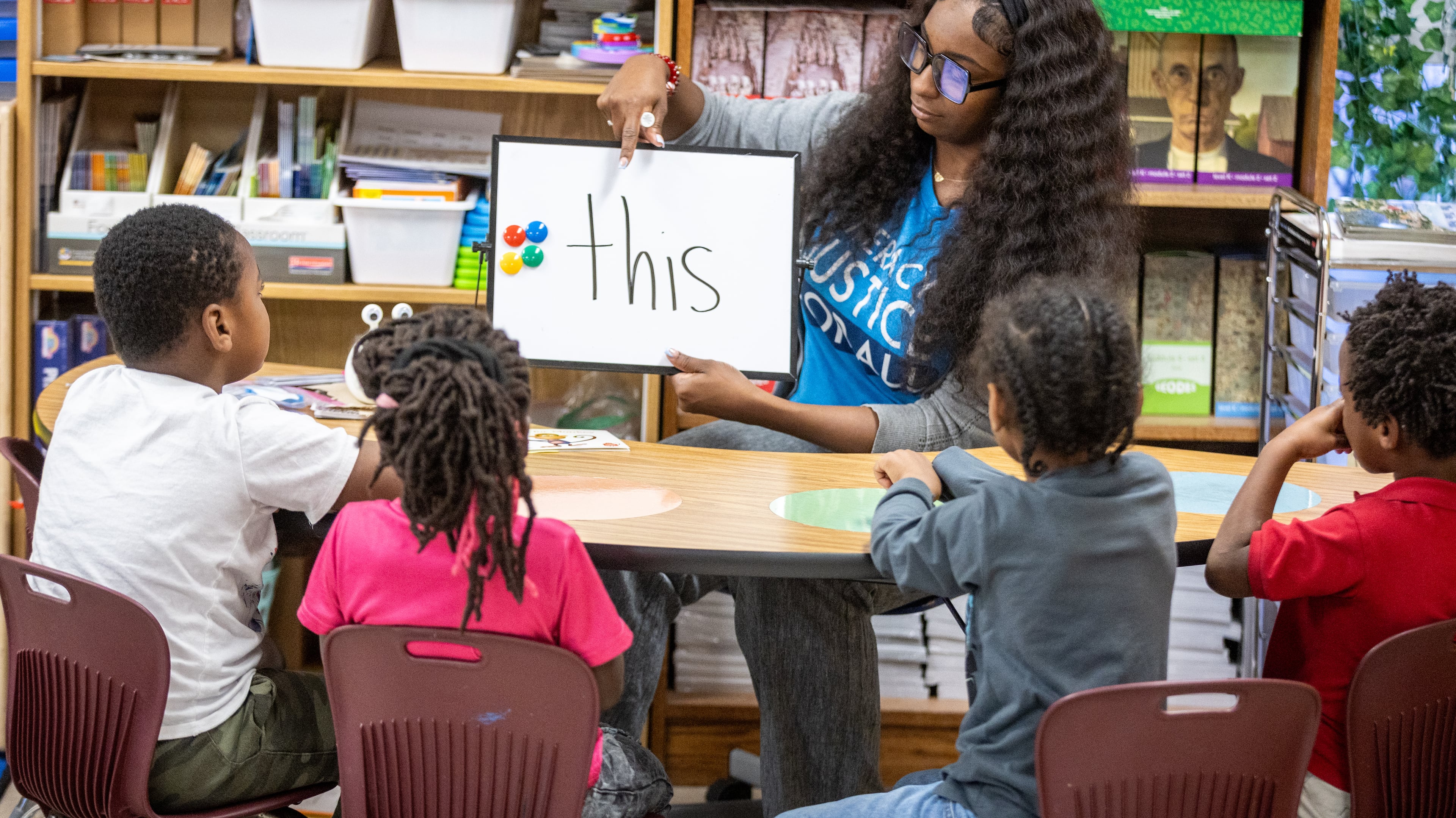 Taylar Morgan w orks with her kindergarten students on their reading skills at Kimberly Elementary School in Atlanta. "Teachers are more than educators; they are anchors who help strengthen our neighborhoods," the APS superintendent says. (AJC/File 2023)