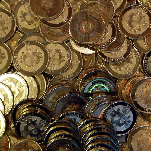 FILE - Bitcoin tokens are seen on April 3, 2013, in Sandy, Utah. (AP Photo/Rick Bowmer, File)