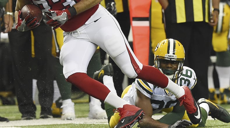 Atlanta Falcons tight end Jacob Tamme (83) runs past Green Bay Packers cornerback LaDarius Gunter (36) during the first of an NFL football game, Sunday, Oct. 30, 2016, in Atlanta. (AP Photo/Rainier Ehrhardt)