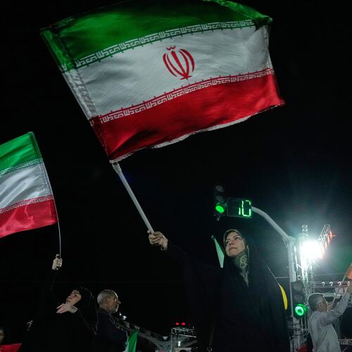 Pro-government demonstrators wave Iranian flags during a gathering in Tehran, Iran, Monday, April 27, 2026. (AP Photo/Vahid Salemi)