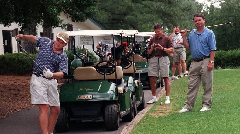 In this 1999 file photo, Tom Duncan of Lawrenceville (left) and Harry Smith of Marietta prepare to tee off at a Golf Tournament to benefit Gwinnett Habitat for Humanity at Northwood Country Club, 6/7/99. Photo by RICHARD FOWLKES/AJC STAFF.