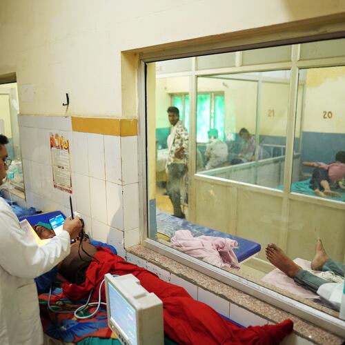 FILE - Dr. Abhishek Pranayami examines a patient suffering from a heat-related illness amid high temperatures at a district government hospital in Banda, northern Indian state of Uttar Pradesh, June 19, 2026 (AP Photo/Rajesh Kumar Singh, File)