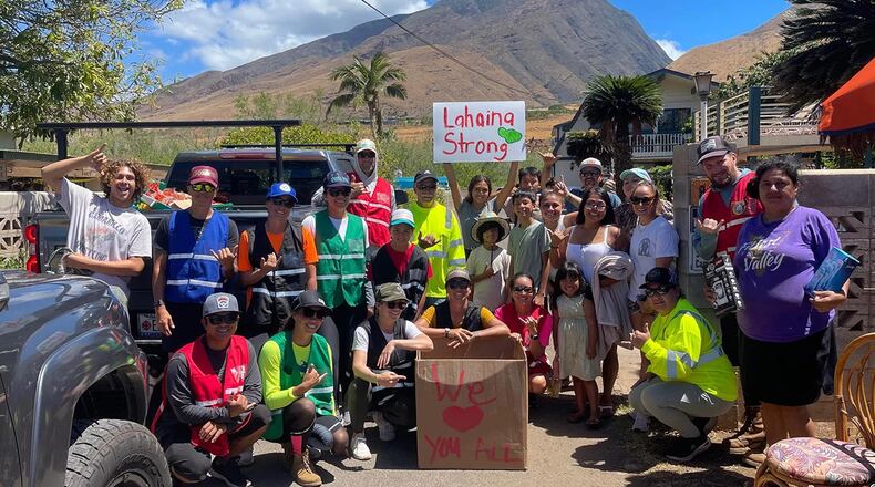 Local volunteers pose for a photo after going door-to-door to deliver supplies, days after the August Hawaii wildfires.
PHOTO COURTESY OF COUNTY OF MAUI