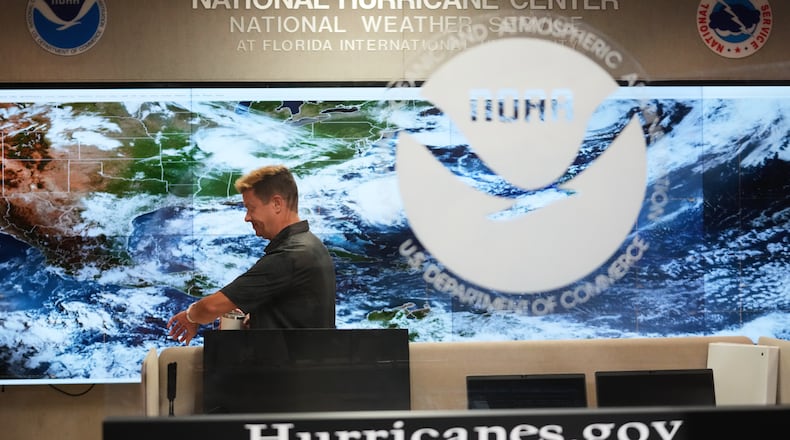 Robbie Berg, Warning Coordinator Meteorologist, works at the National Hurricane Center on the first day of hurricane season, Monday, June 1, 2026, in Miami. (AP Photo/Lynne Sladky)