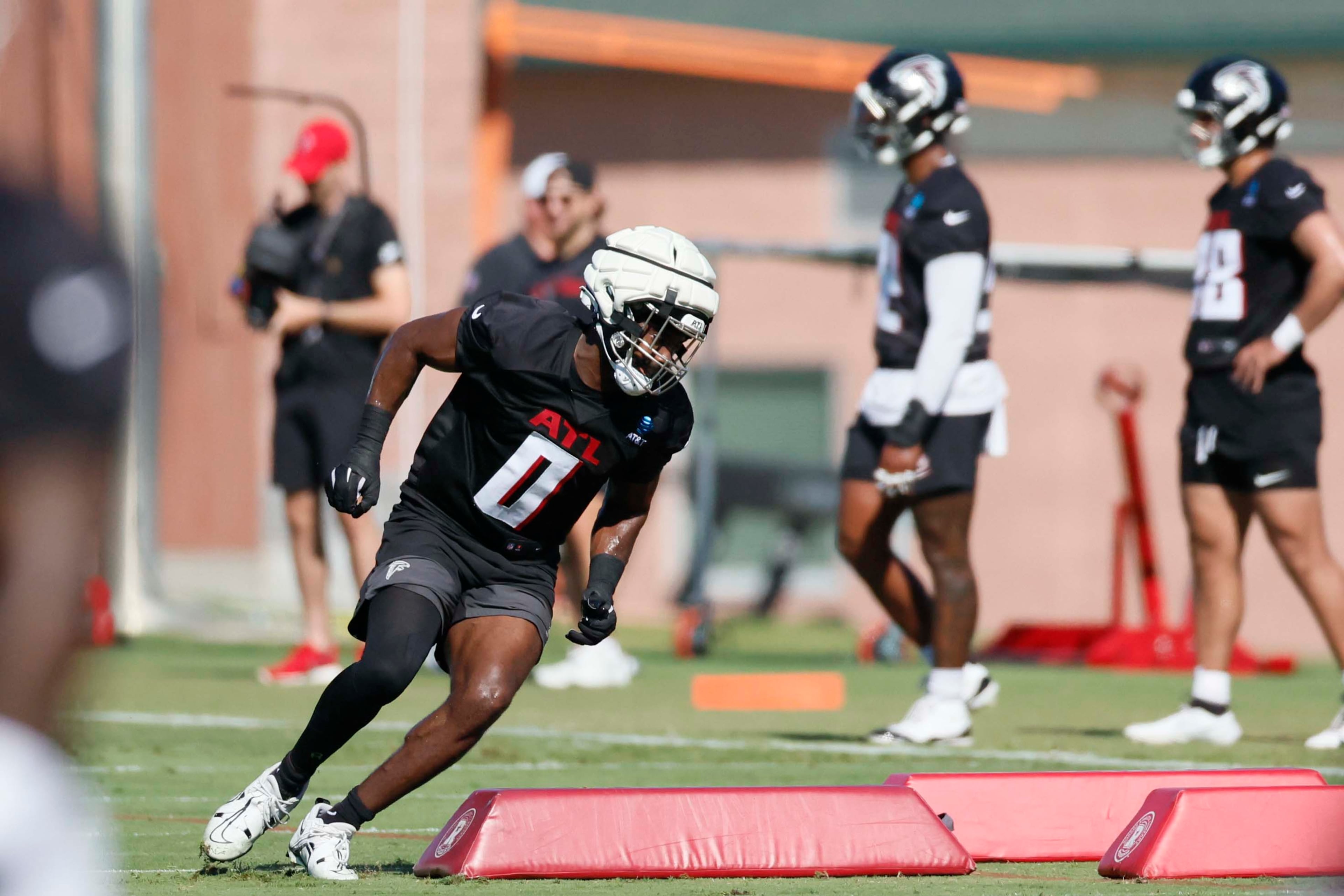 Atlanta Falcons linebacker Divine Deablo runs as he works on a drill during training camp at the Falcons practice facility, on Sunday, July 27, in Flowery Branch, Ga. (Miguel Martinez/AJC)