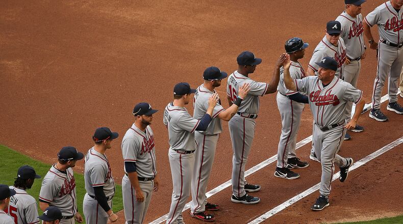 Manager Fredi Gonzalez #33 of the Atlanta Braves greets his team during Opening Day against the Atlanta Braves at Marlins Park on April 6, 2015 in Miami, Florida. The Braves would go on to win 2-1. (Photo by Mike Ehrmann/Getty Images)