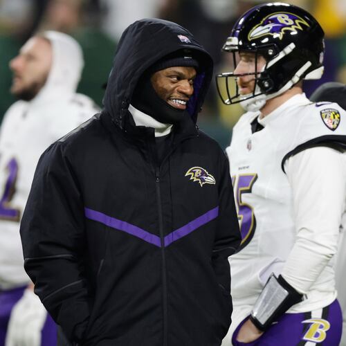 Baltimore Ravens quarterback Lamar Jackson watches on the field during pre-game warm ups before an NFL football game against the Green Bay Packers, Saturday, Dec. 27, 2025, in Green Bay, Wis. (AP Photo/Matt Ludtke)