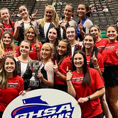 Coach Hillary Sanders (front left) poses with her team after North Oconee gymnastics won the GHSA 2025 Class A-4A state title. The Titans have won six consecutive state championship. (Photo courtesy of Hillary Sanders)