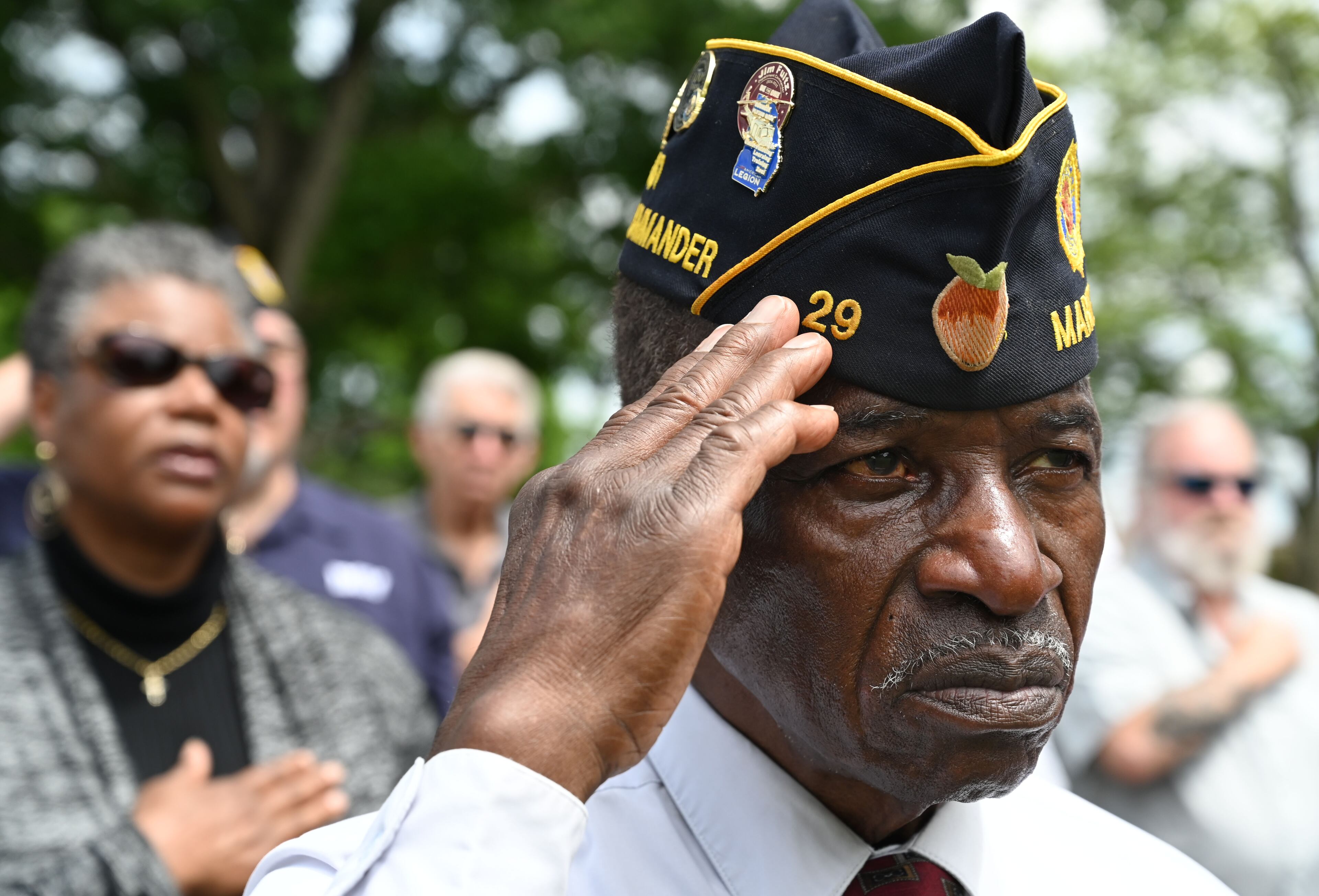Samuel Perry salutes during the playing of the National Anthem while attending the Memorial Day ceremony at Marietta National Cemetery, Monday, May 26, 2025, in Marietta. (Hyosub Shin / AJC)