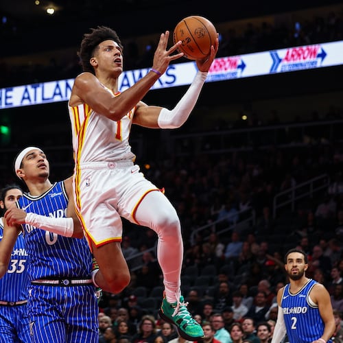 Atlanta Hawks forward Jalen Johnson (1) shoots the ball during the first half of an NBA basketball game against the Orlando Magic, Tuesday, Nov. 4, 2025, in Atlanta. (AP Photo/Colin Hubbard)