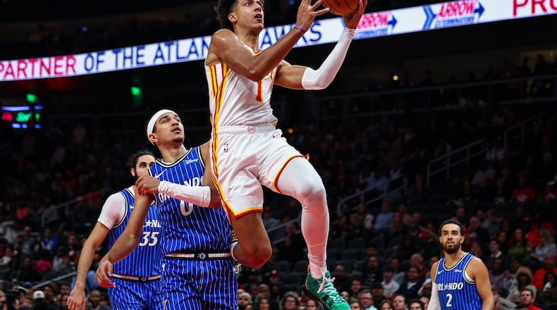 Atlanta Hawks forward Jalen Johnson (1) shoots the ball during the first half of an NBA basketball game against the Orlando Magic, Tuesday, Nov. 4, 2025, in Atlanta. (AP Photo/Colin Hubbard)
