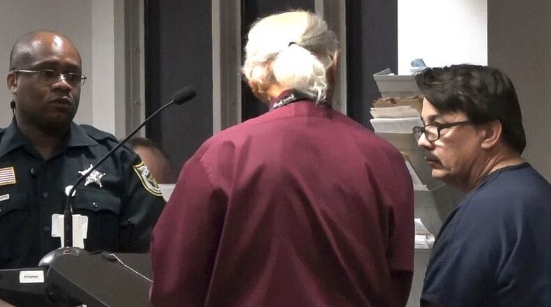 Gary Kitchings talks with a public defender in court Tuesday, May 9, 2017, Kitchings is charged with kidnapping, sexual battery and burglary. The Uber driver is accused of sexual battery on a female customer in his car and then again after he arrived at her home. (Lannis Waters / The Palm Beach Post)