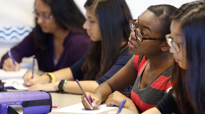 Sep. 1, 2015 - Lawrenceville - Dominique Jeanty, 16, takes notes during her differential equations class at the Gwinnett School of Mathematics, Science, and Technology in Lawrenceville which had the highest combined SAT score among all high schools in Georgia for 2015. BOB ANDRES / BANDRES@AJC.COM